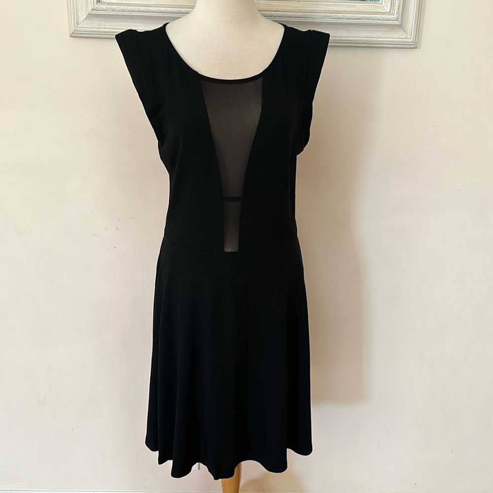 Bebe black dress. Knee length. Size L.